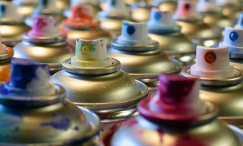 Spray paint cans  close up side view image.