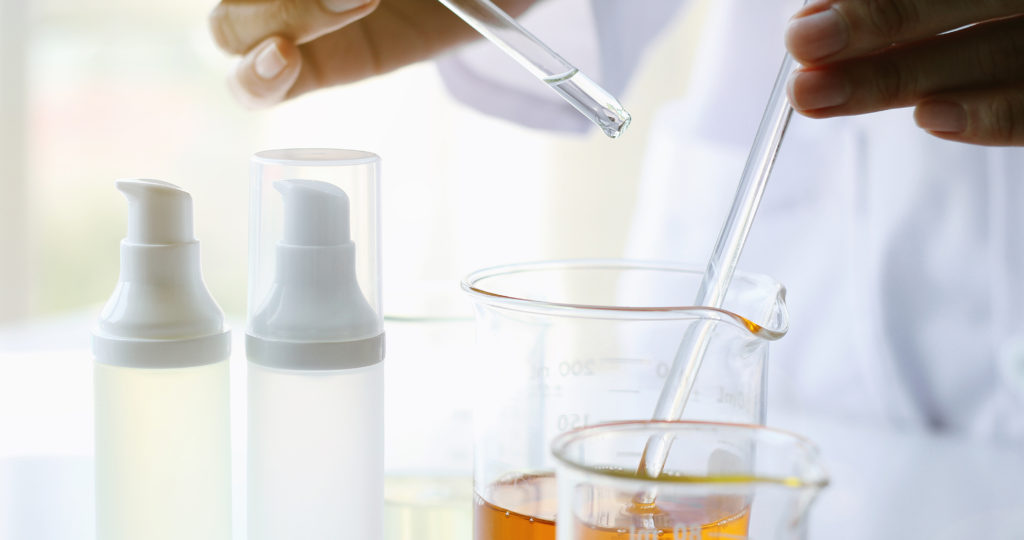 Oil pouring, Equipment and science experiments, Formulating the chemical for medicine, Organic pharmaceutical, Alternative medicine concept. (Selective Focus)